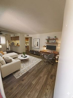 Tempe apartment for rent - A living room with a couch, a chair, a coffee table, and a television.