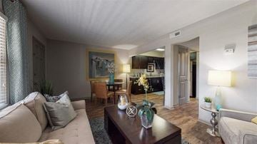 Lexington apartment for rent - A living room with a couch, coffee table, and a painting on the wall.