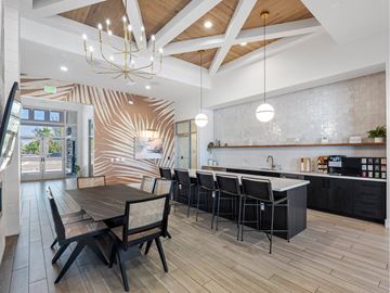 Fort Myers apartment for rent - A modern kitchen with a dining table and chairs.