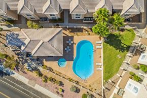 Bullhead City apartment for rent - an aerial view of a swimming pool in front of a house