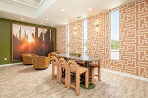 Tucson apartment for rent - A dining room with a wooden table and chairs.