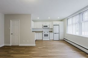 Toronto apartment for rent - an empty kitchen with white appliances and a window at 107 Redpath, Toronto, CA M4S 2J9