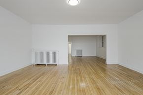 Toronto apartment for rent - Living room with wood floors and white walls at 723 Bloor Apartments, Toronto