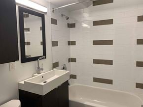 Toronto apartment for rent - a small bathroom with a sink and a bath tub at 177 Saint George in Toronto, CA