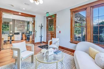 North Haven apartment for rent - A living room with a glass table and white chairs.