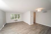 West Hartford apartment for rent - a living room with wood floors and white walls and a window  at Enclave West Hartford / Parc West, West Hartford