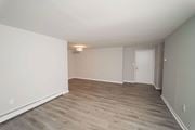 West Hartford apartment for rent - an empty living room with wood floors and white walls at Enclave West Hartford / Parc West, West Hartford, 06110