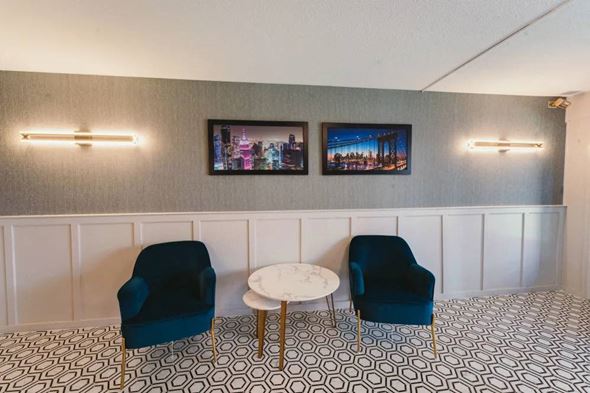 West Hartford apartment for rent - a living room with blue chairs and a white table at Five High, West Hartford