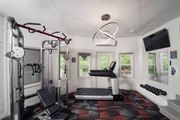 Woodbury apartment for rent - a gym with exercise equipment and a tv at Woodbury Knoll, Woodbury Connecticut