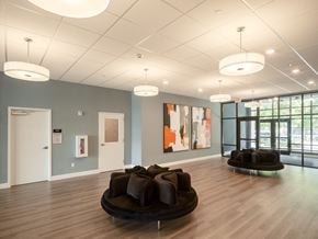 South Burlington apartment for rent - a large room with couches and chairs in the center of it