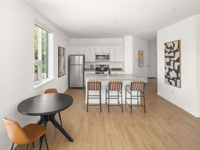 South Burlington apartment for rent - A modern kitchen with a dining table and chairs.