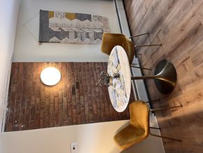 Colchester apartment for rent - A modern dining room with a wooden table and chairs.
