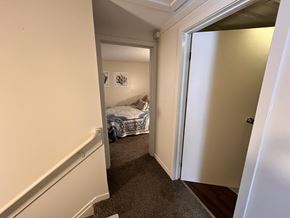 Colchester apartment for rent - A bedroom with a bed and a carpeted floor.