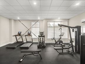 South Burlington apartment for rent - A gym with treadmills, elliptical machines, and a weight machine.