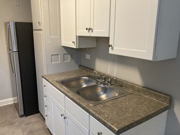 Colchester apartment for rent - A kitchen with a sink and a refrigerator.