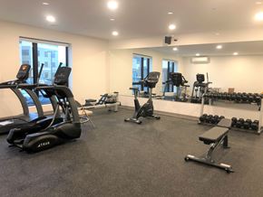 Burlington apartment for rent - A gym with treadmills, weights, and exercise equipment.