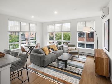 South Burlington apartment for rent - A living room with a grey couch and a coffee table.