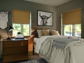 Burlington apartment for rent - a bedroom with a bed and a picture of a bull