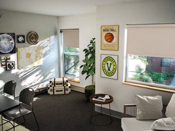 Burlington apartment for rent - a living room with a table and chairs and a window