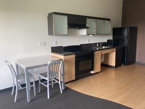 Burlington apartment for rent - a kitchen with a table and chairs and a kitchen
