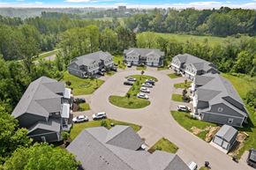 Holland apartment for rent - A bird's eye view of a residential area with houses and cars.