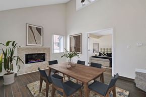 Southfield apartment for rent - a dining room with a table and chairs and a fireplace