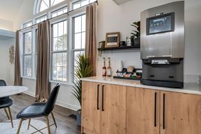 Wheeling apartment for rent - a kitchen with a counter and a refrigerator and a window