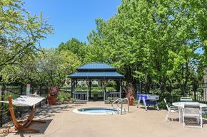 Wheeling apartment for rent - a patio with a pool and a gazebo
