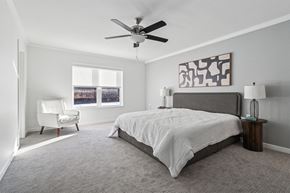 Inver Grove Heights apartment for rent - A bedroom with a large bed and a ceiling fan.