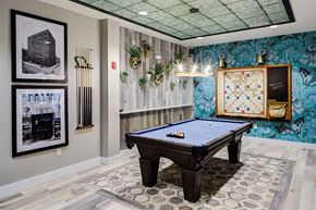 Beachwood apartment for rent - a game room with a pool table and a bulletin board