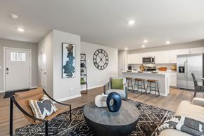 Ankeny apartment for rent - A modern living room with a large clock on the wall.