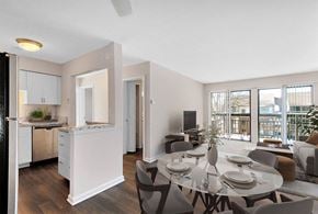 Bloomfield Hills apartment for rent - A modern kitchen with a dining table set for four.