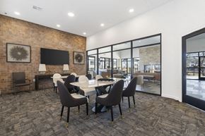 Rogers apartment for rent - A conference room with a long table and chairs.