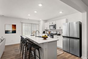 Hobart apartment for rent - A modern kitchen with a large island and stainless steel appliances.