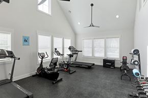 Plymouth apartment for rent - A spacious home gym with a variety of exercise equipment.