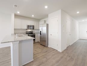Byhalia apartment for rent - A kitchen with a granite countertop and stainless steel appliances.