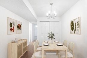 Fayetteville apartment for rent - A dining room with a wooden table set for four.