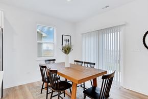 Crown Point apartment for rent - A dining room with a wooden table and chairs.