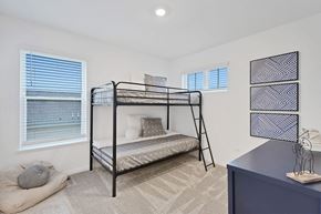 Crown Point apartment for rent - A bedroom with a bunk bed and a blue dresser.