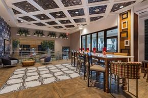 Cincinnati apartment for rent - A dining room with a wooden table and chairs.