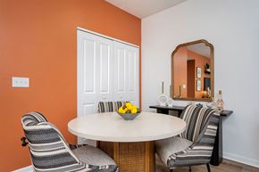Westerville apartment for rent - a dining room with two chairs and a table with a bowl of fruit