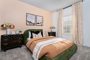 Westerville apartment for rent - a bedroom with a bed and a large window