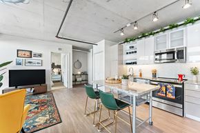 Cleveland apartment for rent - a kitchen with a granite counter top and a mobile kitchen island
