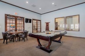 Plainfield apartment for rent - A room with a pool table and a table with chairs.