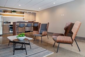 Lansing apartment for rent - A modern dining room with a table and chairs.