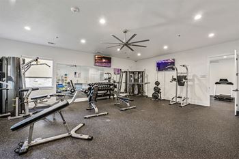 24-Hour fitness center with cardio and strength training equipment