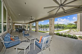 Covered outdoor lounge with ceiling fans