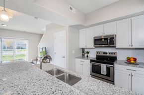 Grove City apartment for rent - A kitchen with granite countertops and stainless steel appliances.