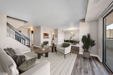 Detroit apartment for rent - A living room with a white couch and a coffee table.