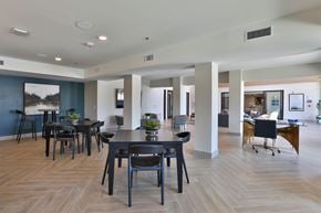 New Braunfels apartment for rent - A spacious room with a dining table and chairs.